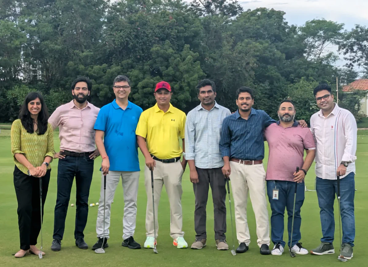 Golfers gathered with Amit Khaitan during a group session